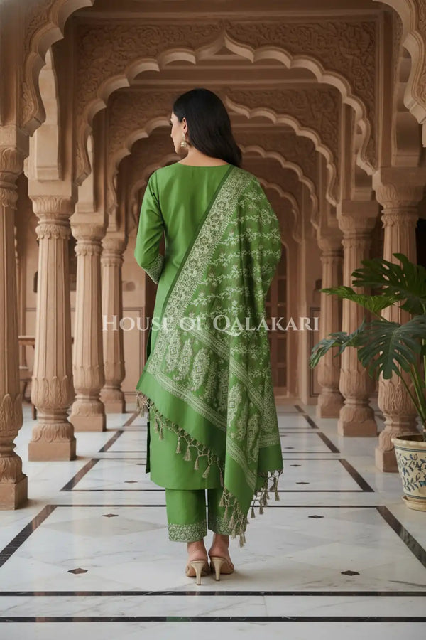 Banarasi Unstitched Dress Material in Light Olive Green and with plain body and resham border and diagonally striped resham dupatta – back pose