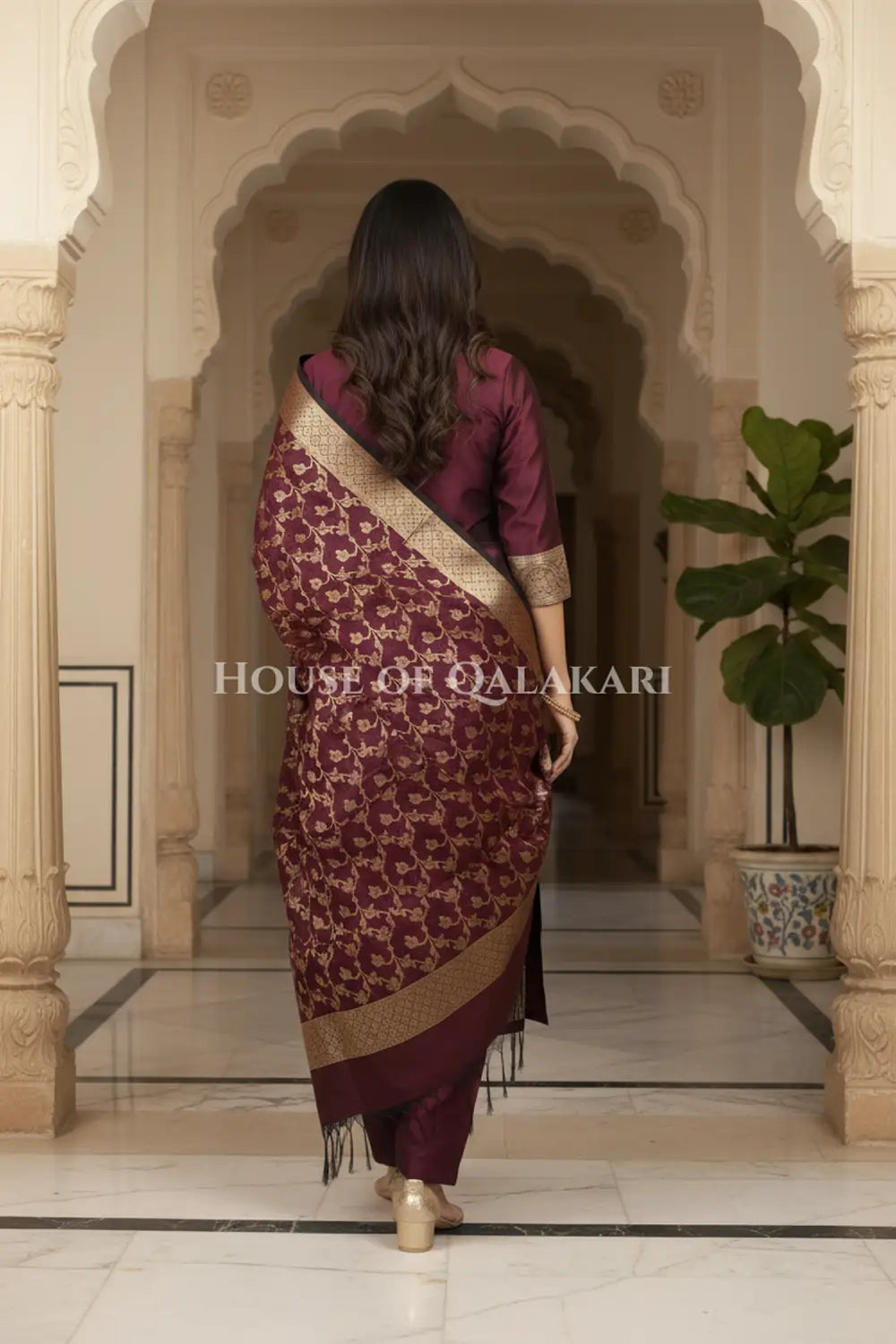 Banarasi Unstitched Dress Material in Velvet Maroon plain kurta and zari border along with floral zari jaal dupatta – back pose