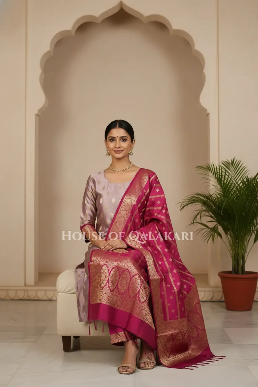 Banarasi Silk in lilac and magenta contrast with Intricate Zari Buti – sitting pose