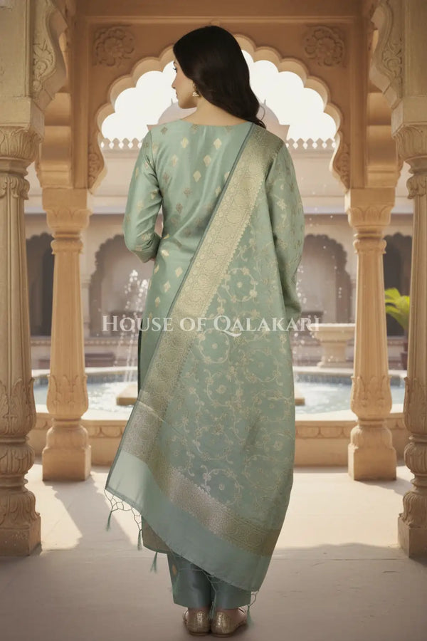 Banarasi Cotton Silk blend Unstitched Dress Material in Antique Aqua green colour with Intricate Zari Diamond Buti – back pose