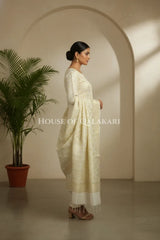 Cream Banarasi Chanderi Cotton Unstitched Dress Material with Zari Work – side pose