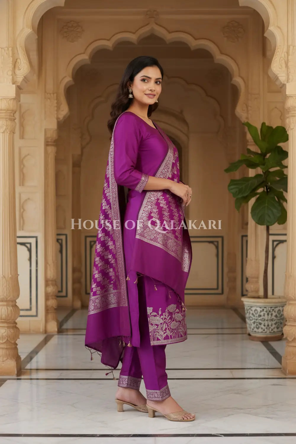 Banarasi silk Unstitched Dress Material in Rich Purple and with lotus floral border and diagonal striped zari work dupatta – side pose