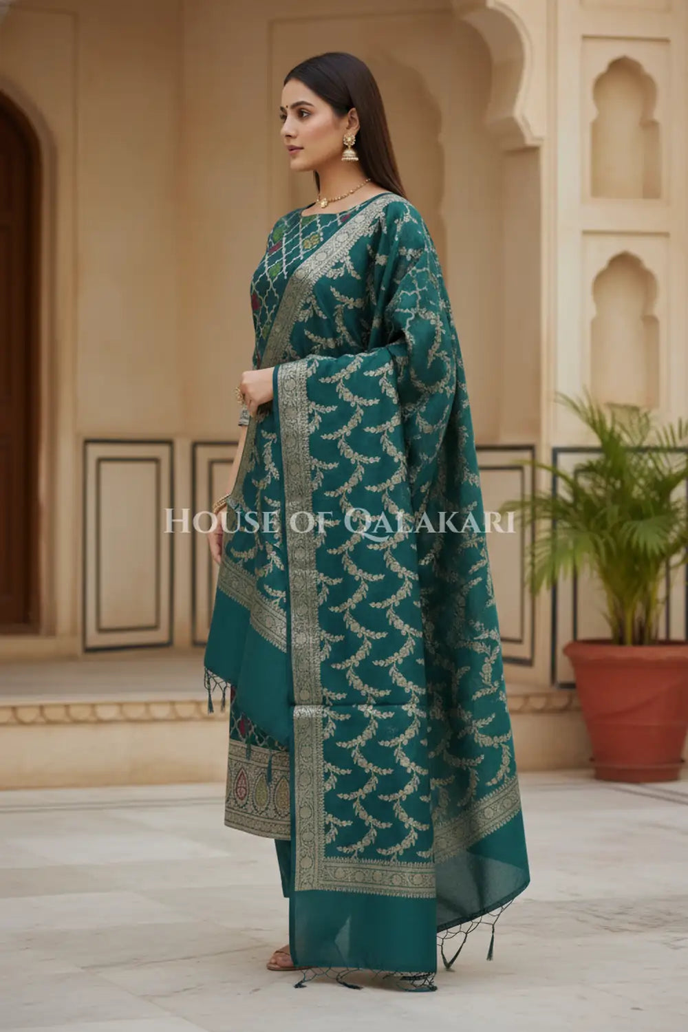Banarasi Chanderi Cotton Unstitched Dress Material in Bottle Green and with matching floral vine jaal dupatta – side pose