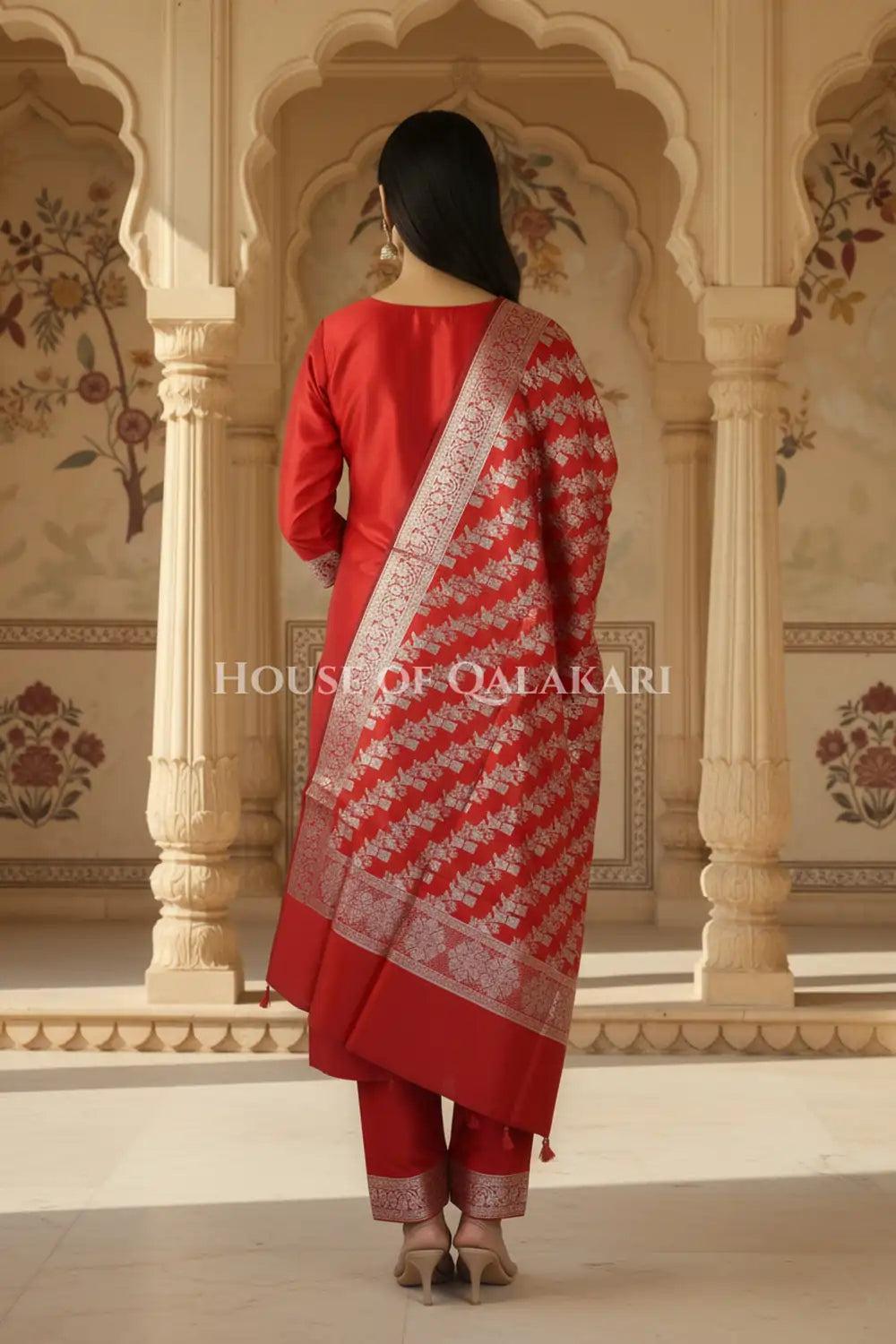Banarasi silk Unstitched Dress Material in Red and with lotus floral border and diagonal striped zari work dupatta – back pose