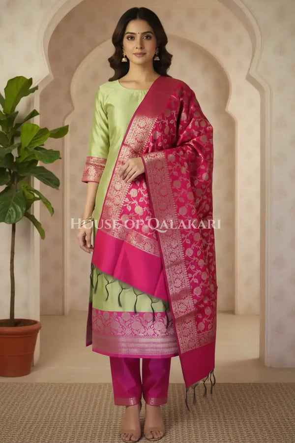 Banarasi silk Unstitched Dress Material in parrot green and pink contrast with Intricate Zari Buti – front pose