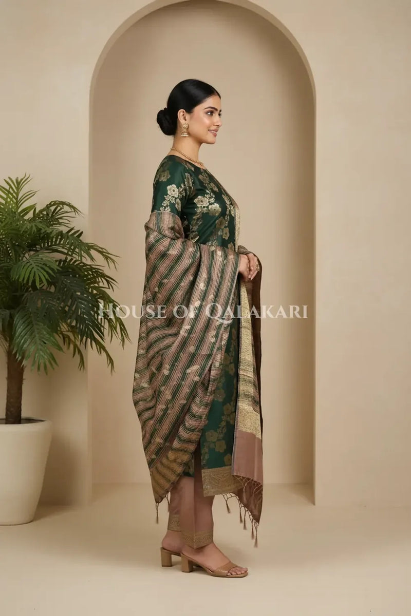 Banarasi Cotton Silk blend Unstitched Dress Material in deep emerald green and rose gold contrast with Intricate Zari Buti – side pose