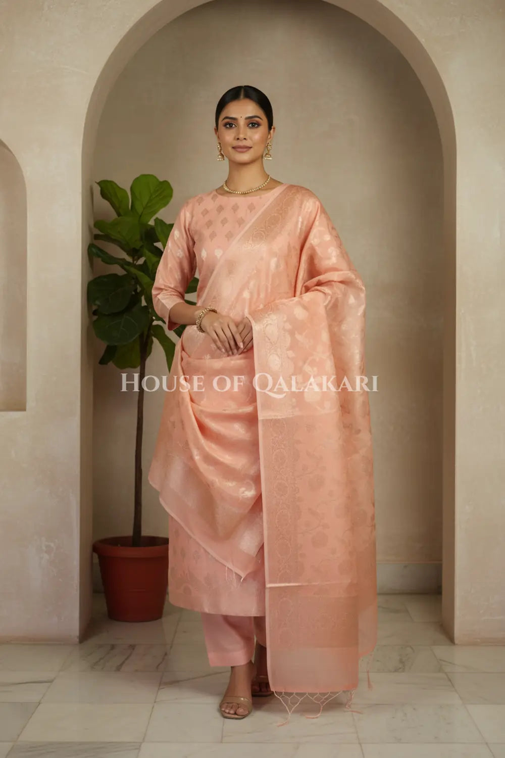 Banarasi Chanderi Cotton Unstitched Dress Material in Peach Pink with intricate Zari Buti work – front pose