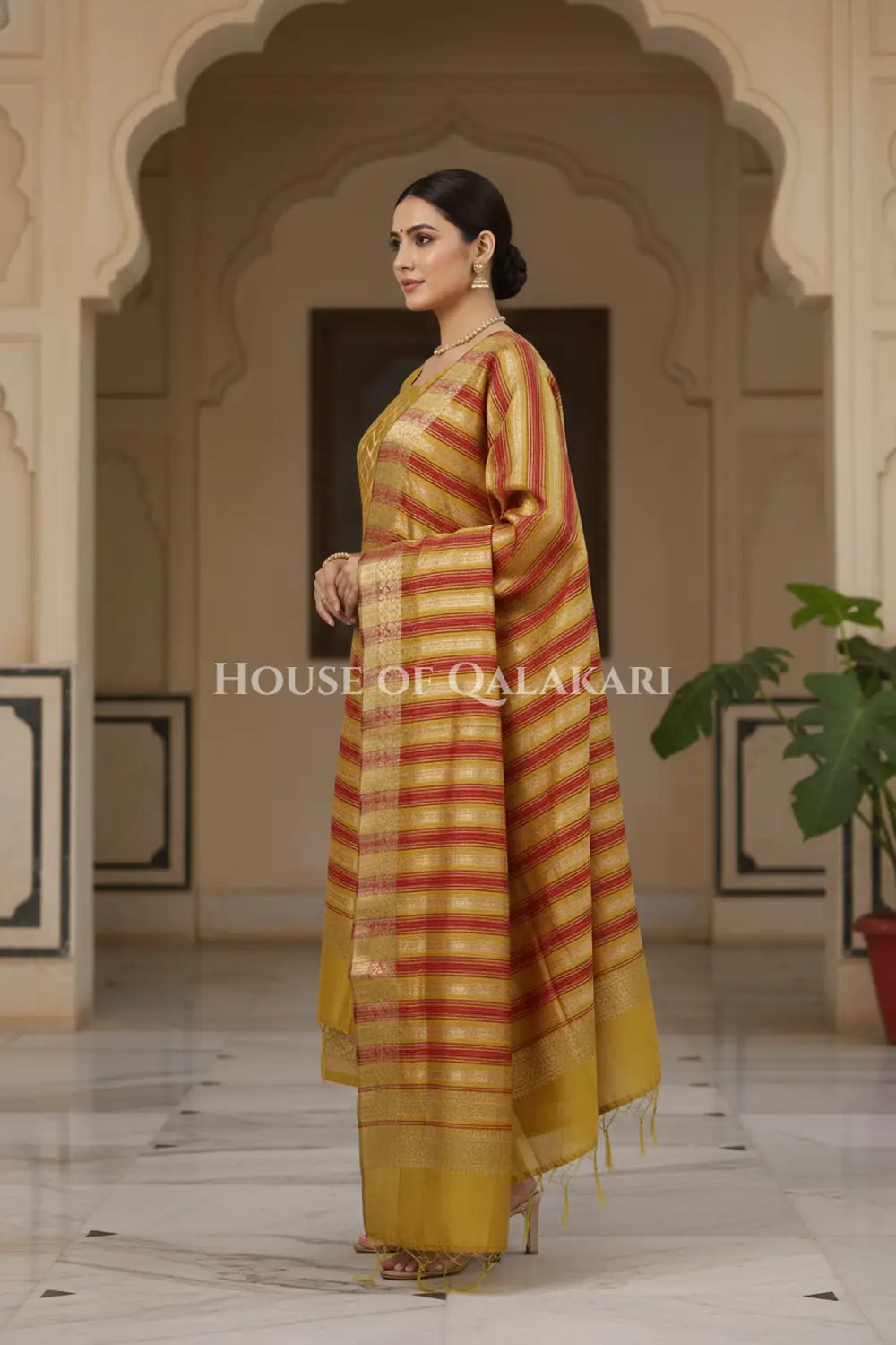 Banarasi Chanderi Cotton Unstitched Dress Material in Mustard and with matching horizontal zari stripe dupatta – side pose