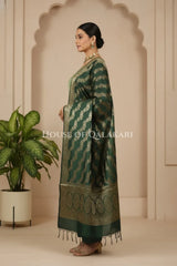 Banarasi Silk in pistachio green and bottle green contrast with Intricate Zari Buti – side pose