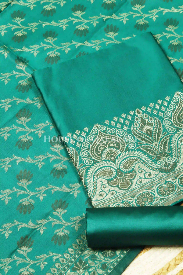 Banarasi Unstitched Dress Material in Emerald Green and with plain body and resham border and diagonally striped resham dupatta – product