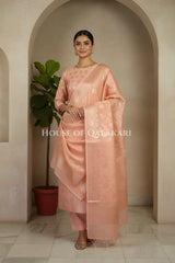 Banarasi Chanderi Cotton Unstitched Dress Material in Peach Pink with intricate Zari Buti work – festive pose