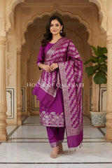 Banarasi silk Unstitched Dress Material in Rich Purple and with lotus floral border and diagonal striped zari work dupatta – front pose