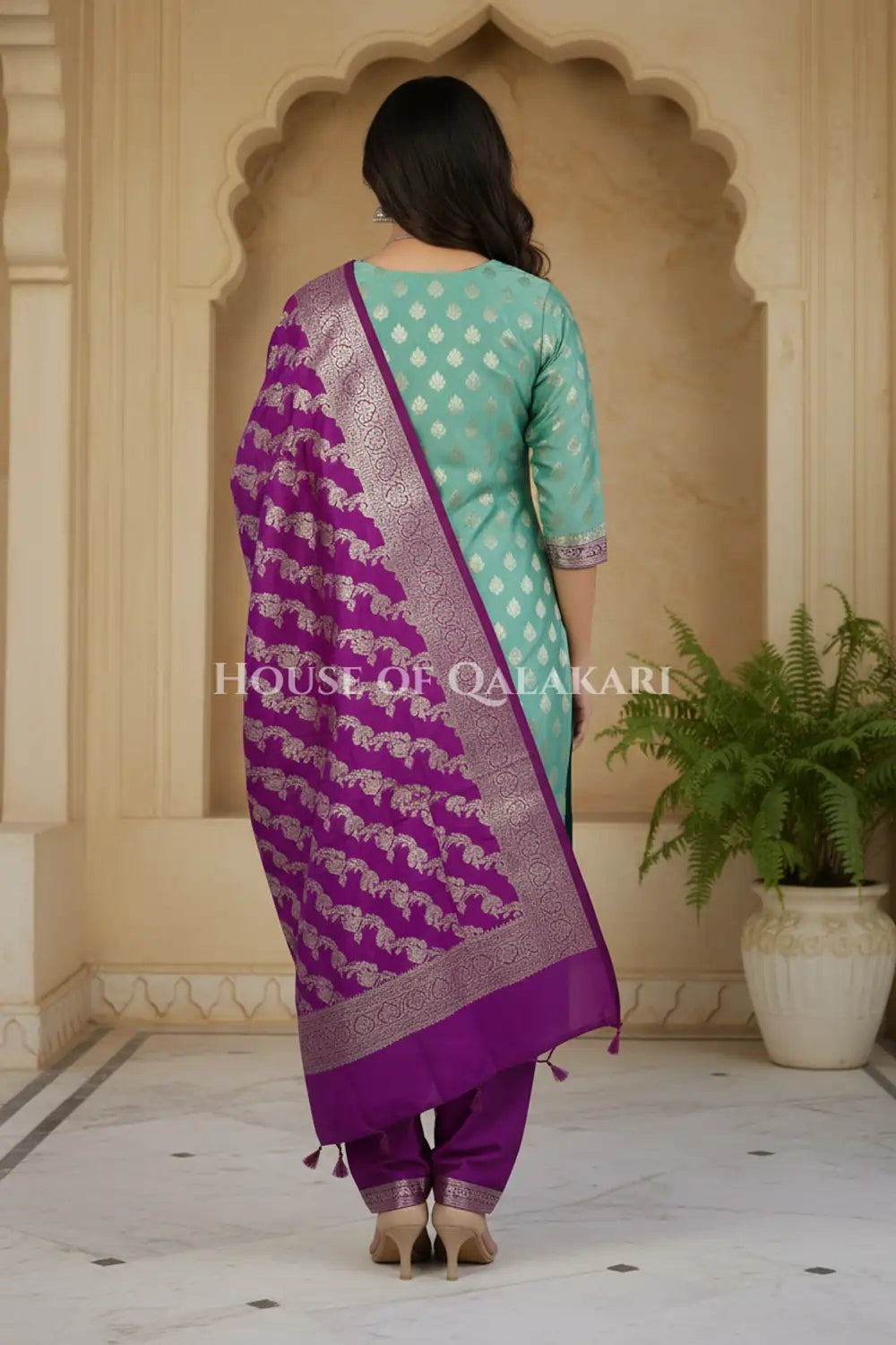 Banarasi Silk Unstitched Dress Material in Light Teal Green and Rich Purple contrast with Intricate Zari Buti – back pose