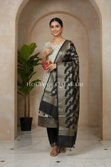 Banarasi Silk Unstitched Dress Material in light grey and black contrast with Intricate Zari Buti – festive pose
