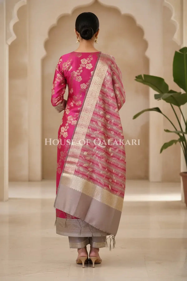 Banarasi Cotton Silk blend Unstitched Dress Material in rani pink and silver grey contrast with Intricate Zari Buti – back pose