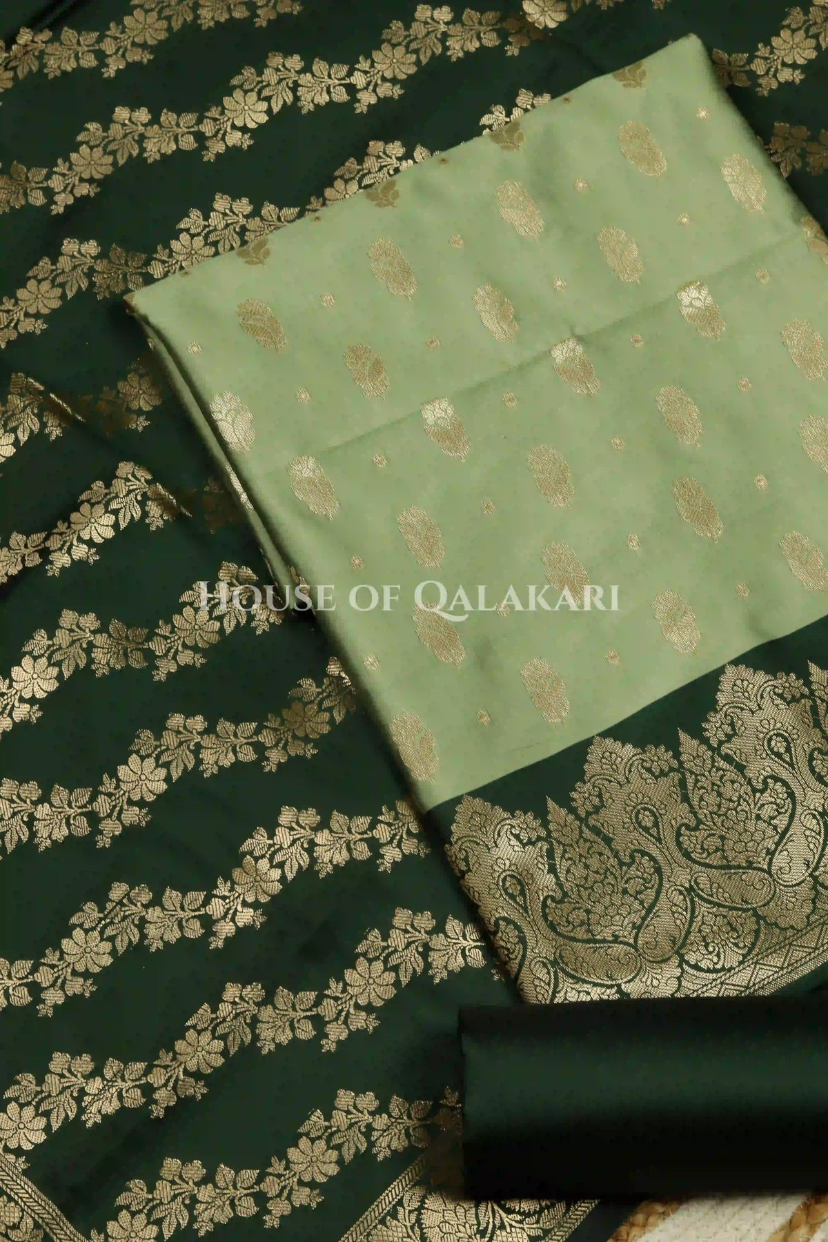 Banarasi Silk in pistachio green and bottle green contrast with Intricate Zari Buti – product