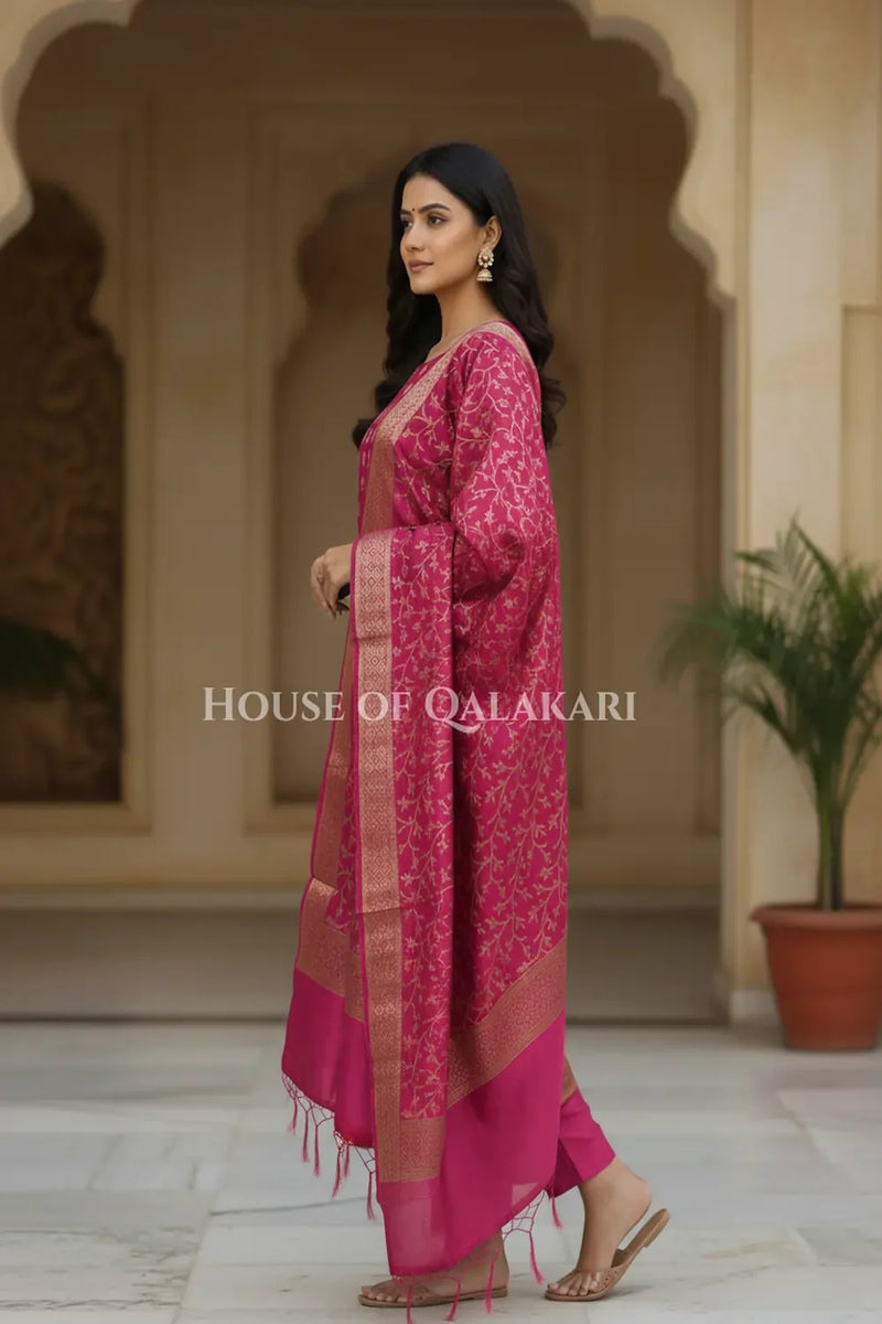 Banarasi Cotton Silk blend Unstitched Dress Material in Rani Pink and with matching floral vine jaal dupatta – side pose