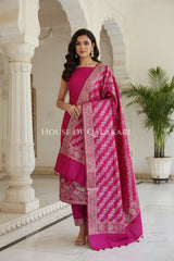 Banarasi silk Unstitched Dress Material in Rani Pink and with lotus floral border and diagonal striped zari work dupatta – front pose
