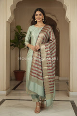 Banarasi Cotton Silk blend Unstitched Dress Material in Cement Grey and with contrast Dark brown-Cement Grey striped dupatta – festive pose
