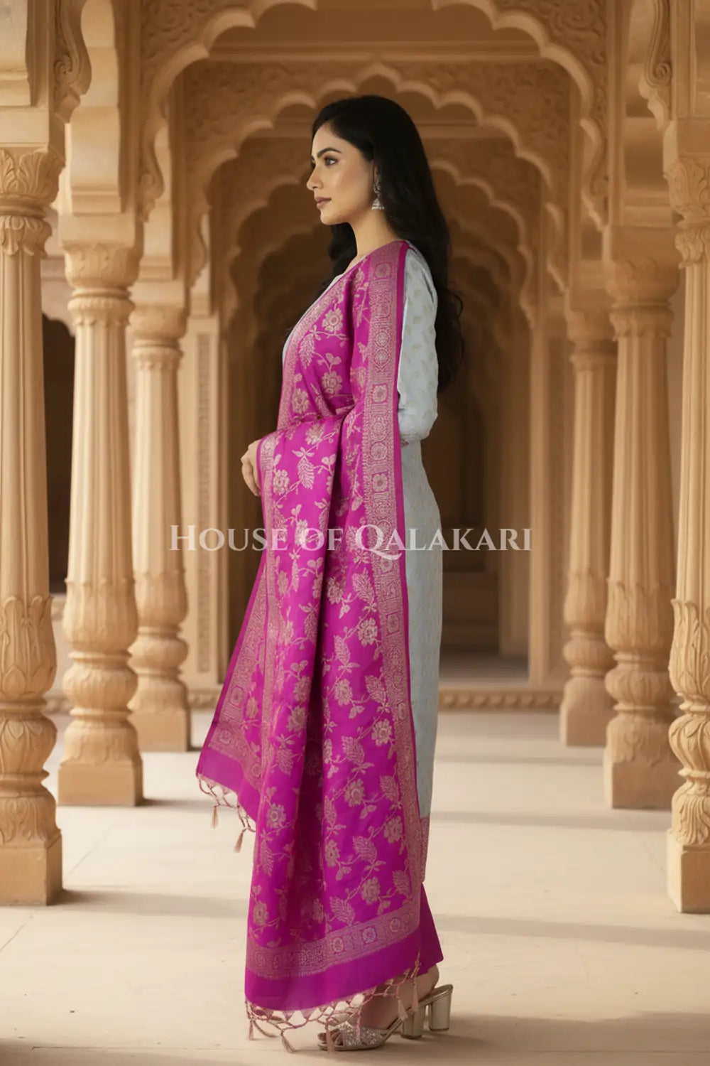 Banarasi Unstitched Dress Material in Light Blue and with all over leaf buti and resham border along with floral resham jaal dupatta – side pose