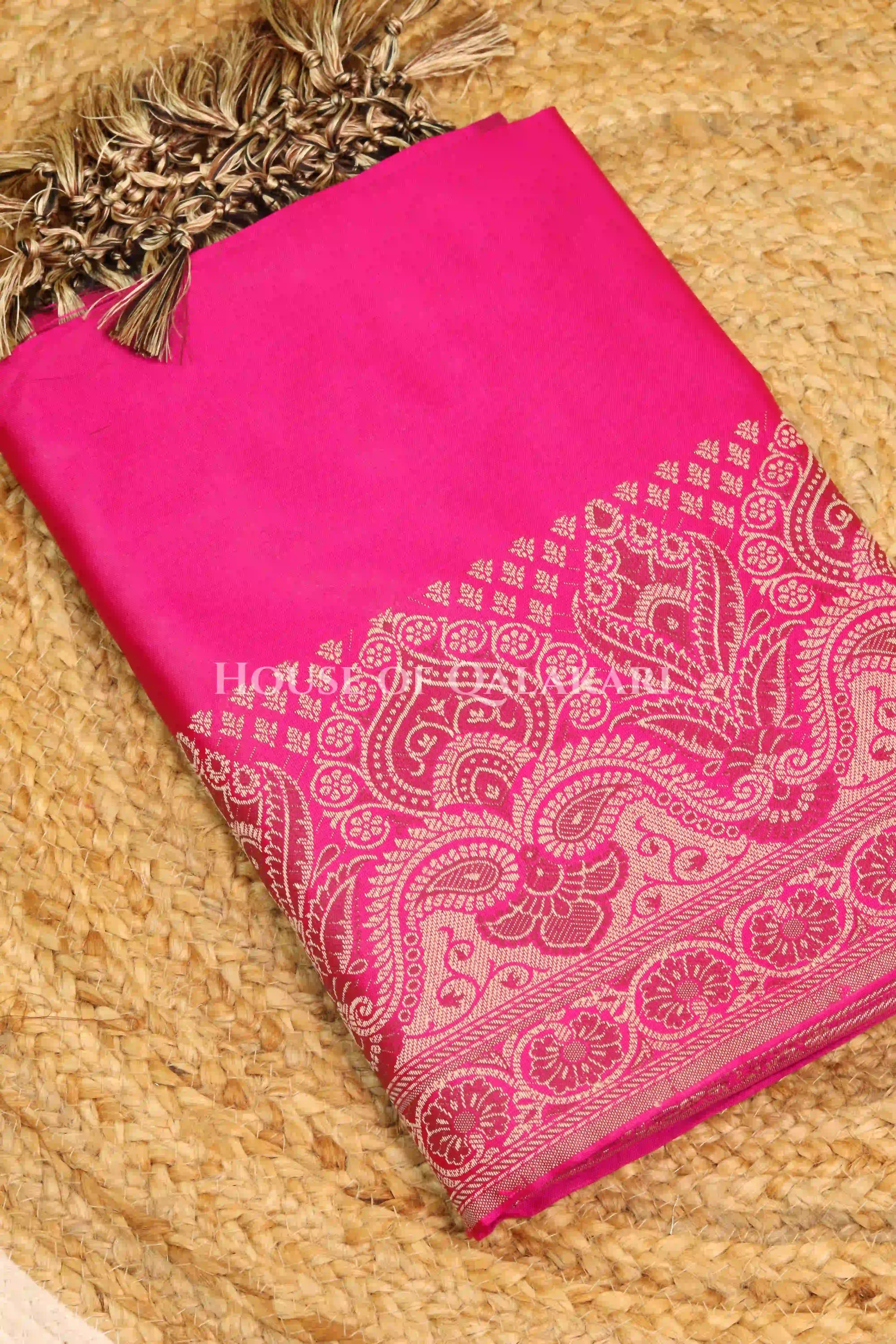 Banarasi Unstitched Dress Material in Rani Pink and with plain body and resham border and diagonally striped resham dupatta – kurta