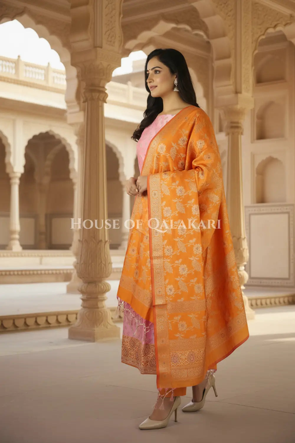 Banarasi Unstitched Dress Material in Dull Pink and with all over leaf buti and resham border along with floral resham jaal dupatta – side pose