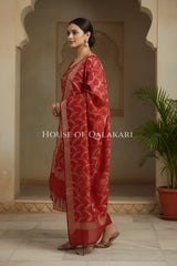 Banarasi Chanderi Cotton Unstitched Dress Material in Red and with matching floral vine jaal dupatta – side pose