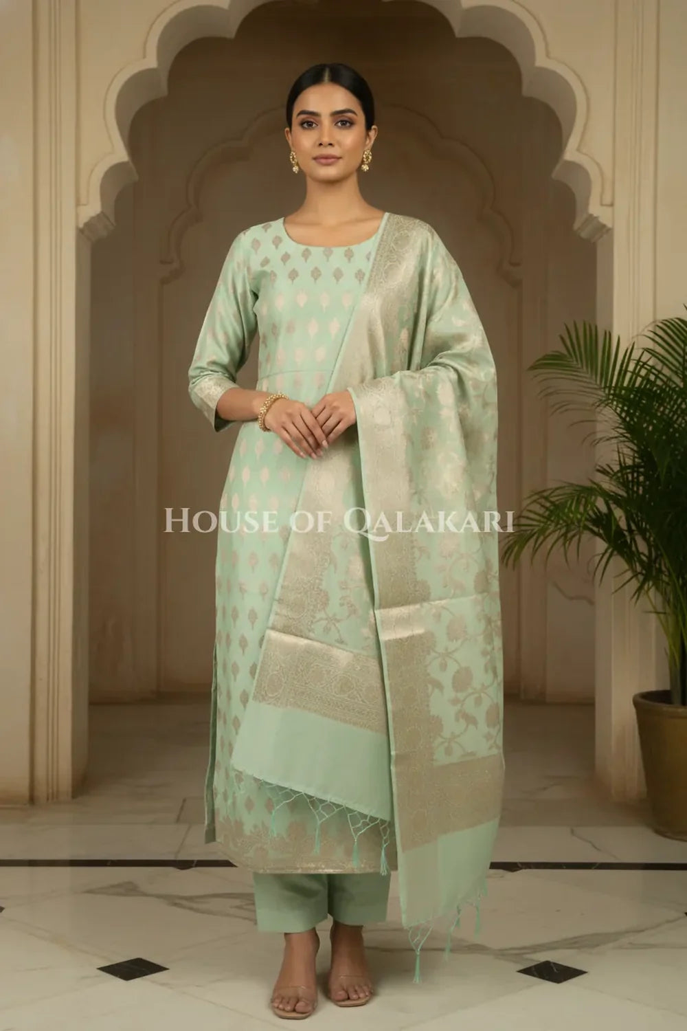 Banarasi Chanderi Cotton Unstitched Dress Material in Mint Green with intricate Zari Buti work – front pose