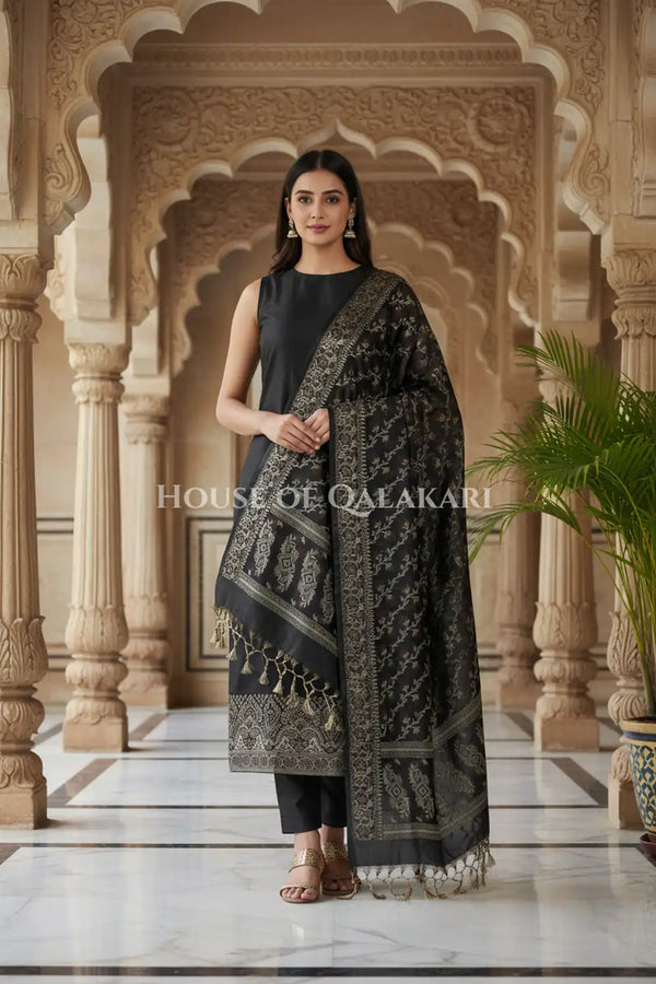Banarasi Unstitched Dress Material in Black and with plain body and resham border and diagonally striped resham dupatta – front pose