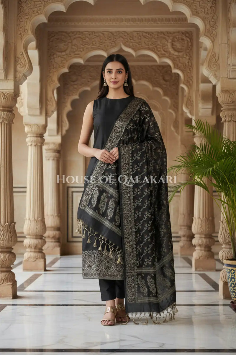 Banarasi Unstitched Dress Material in Black and with plain body and resham border and diagonally striped resham dupatta – front pose