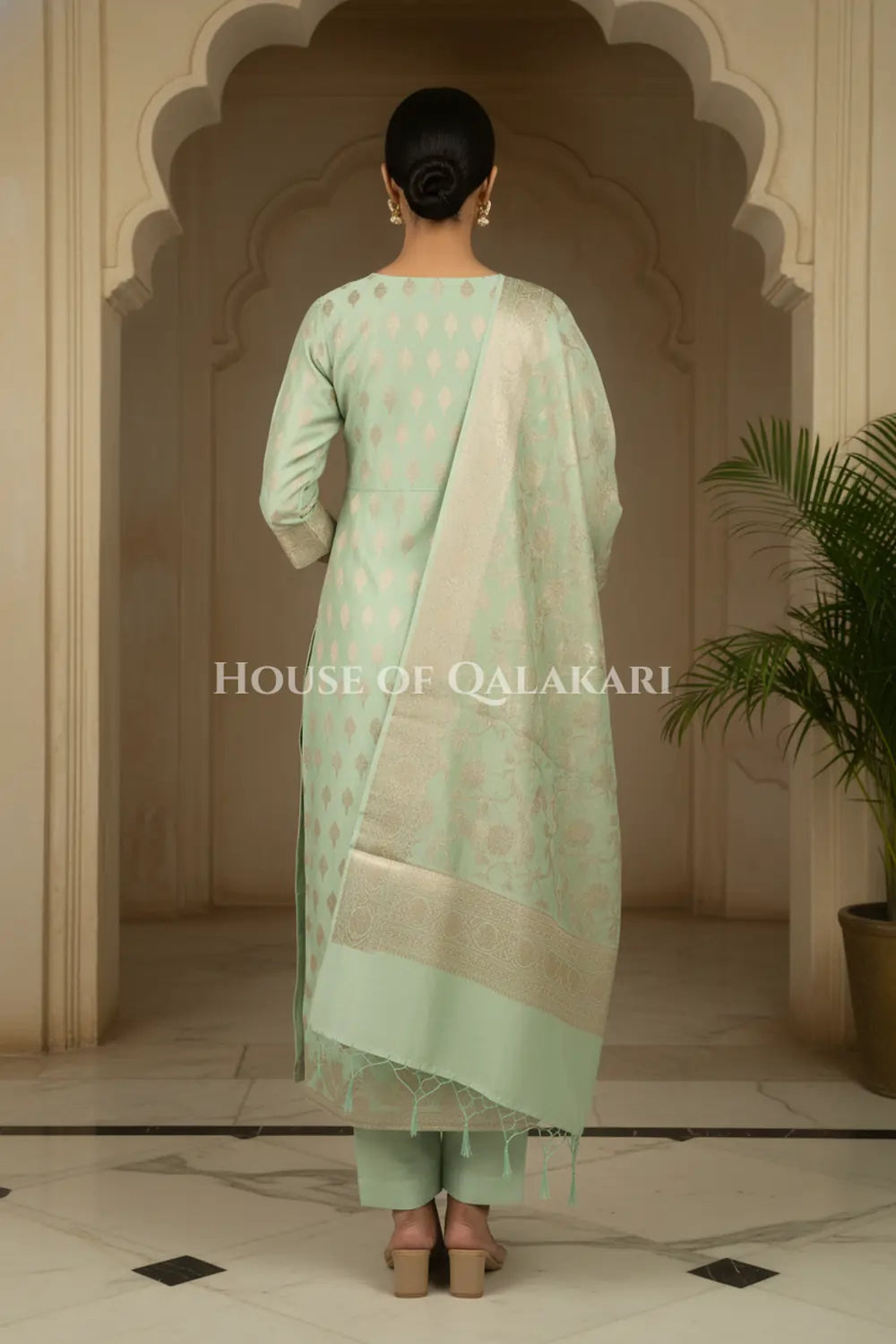 Banarasi Chanderi Cotton Unstitched Dress Material in Mint Green with intricate Zari Buti work – back pose