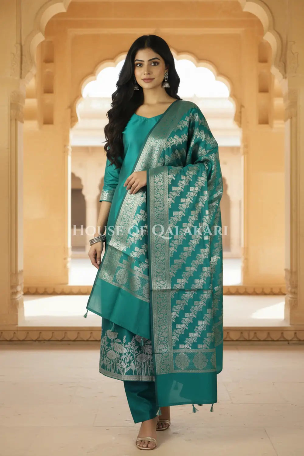 Banarasi silk Unstitched Dress Material in Emerald Green and with lotus floral border and diagonal striped zari work dupatta – front pose