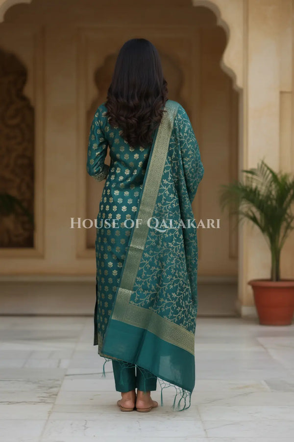 Banarasi Cotton Silk blend Unstitched Dress Material in Deep Teal Green and with matching floral vine jaal dupatta – back pose