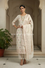Banarasi Chanderi Cotton Unstitched Dress Material in Cream and with matching floral vine jaal dupatta – festive pose