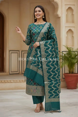 Banarasi Chanderi Cotton Unstitched Dress Material in Bottle Green and with matching floral vine jaal dupatta – festive pose