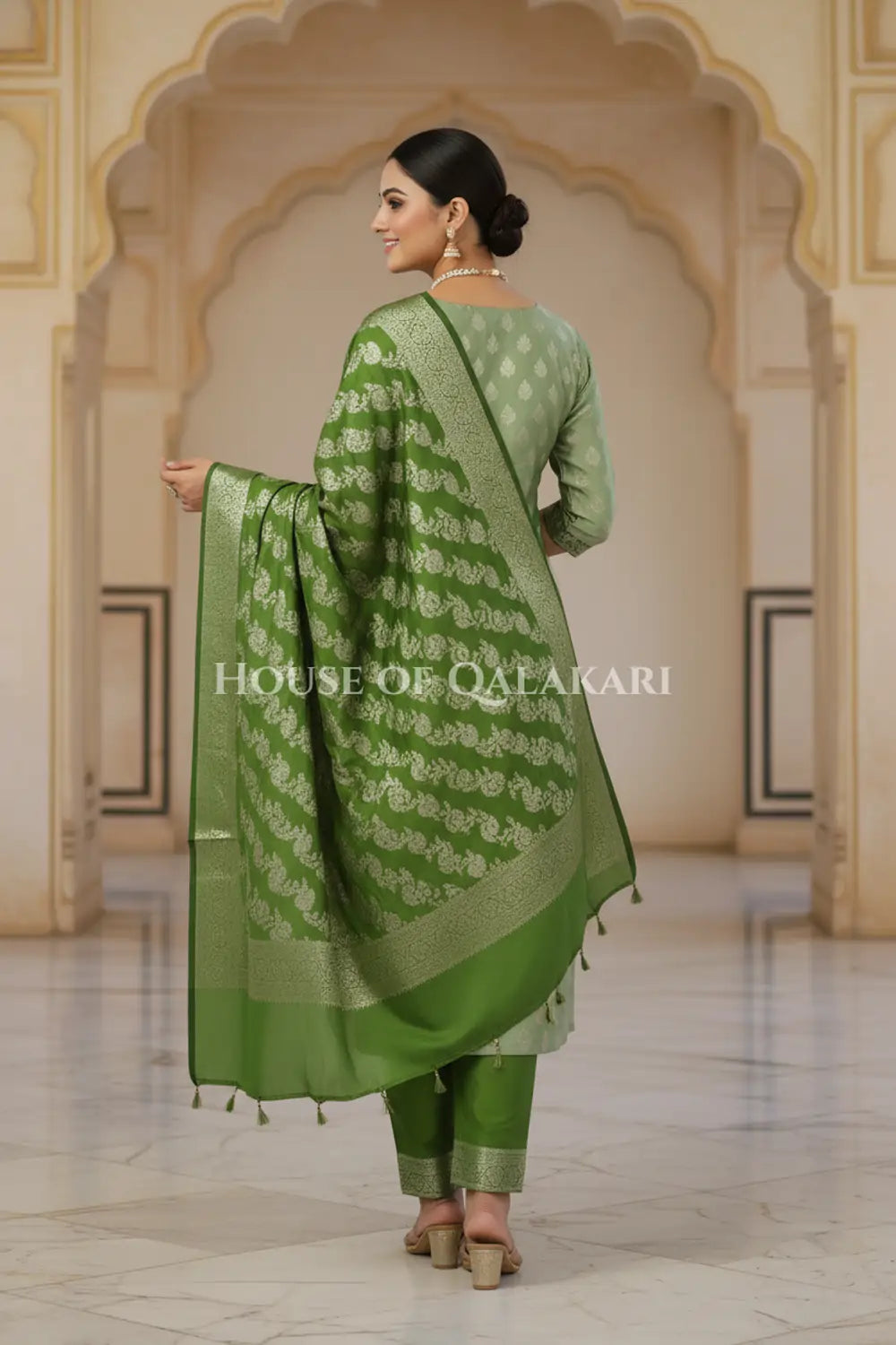 Banarasi Silk Unstitched Dress Material in Sage Green and Green contrast with Intricate Zari Buti – back pose