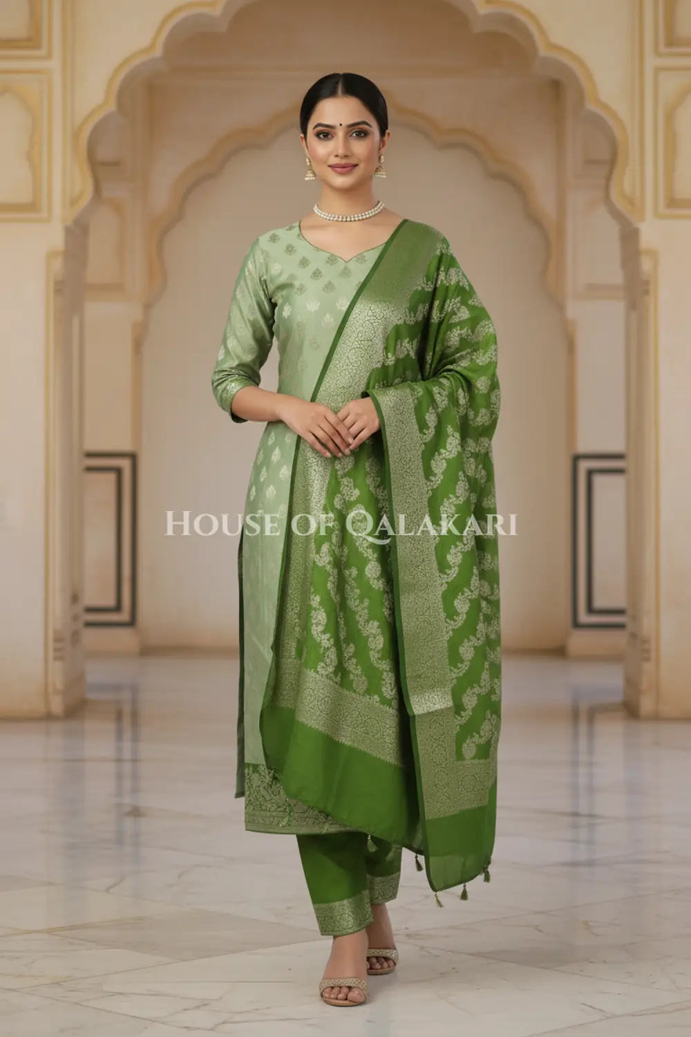 Banarasi Silk Unstitched Dress Material in Sage Green and Green contrast with Intricate Zari Buti – front pose