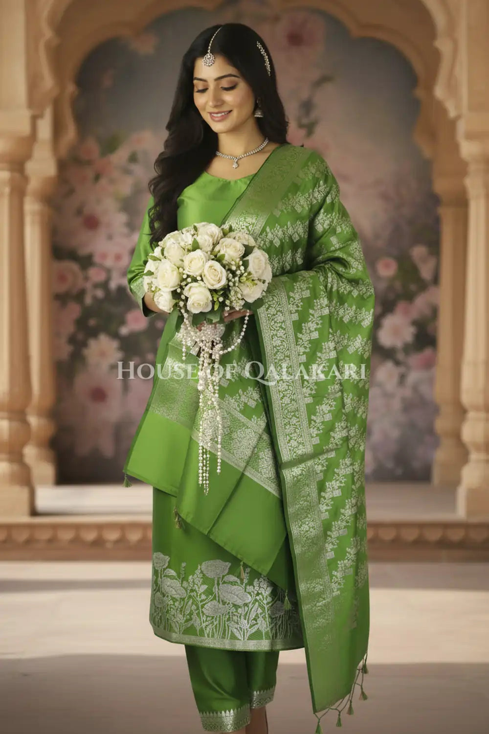 Banarasi silk Unstitched Dress Material in Light Olive Green and with lotus floral border and diagonal striped zari work dupatta – wedding pose