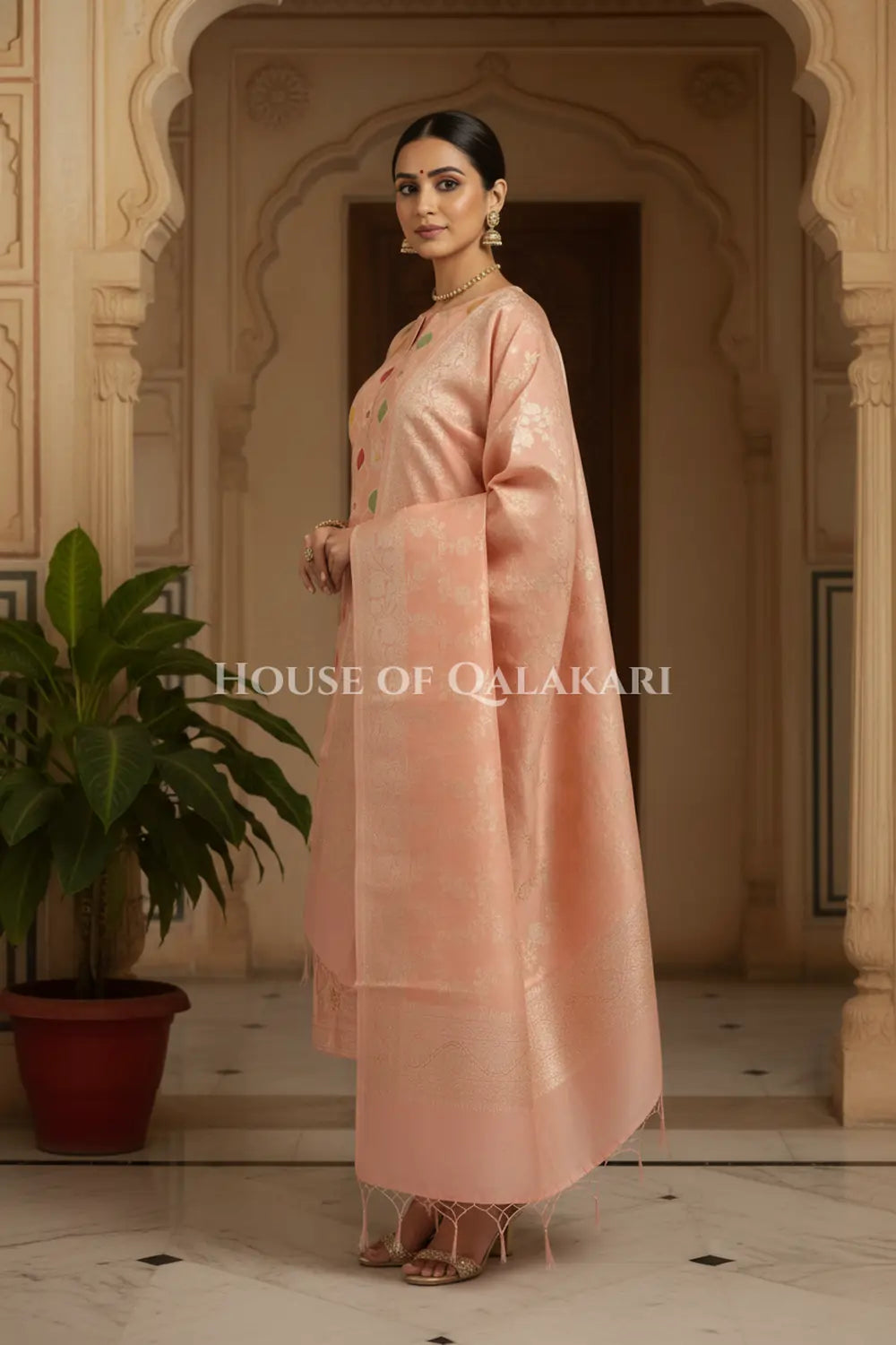 Banarasi Chanderi Cotton Unstitched Dress Material in Peach and with matching zari floral jaal dupatta – side pose