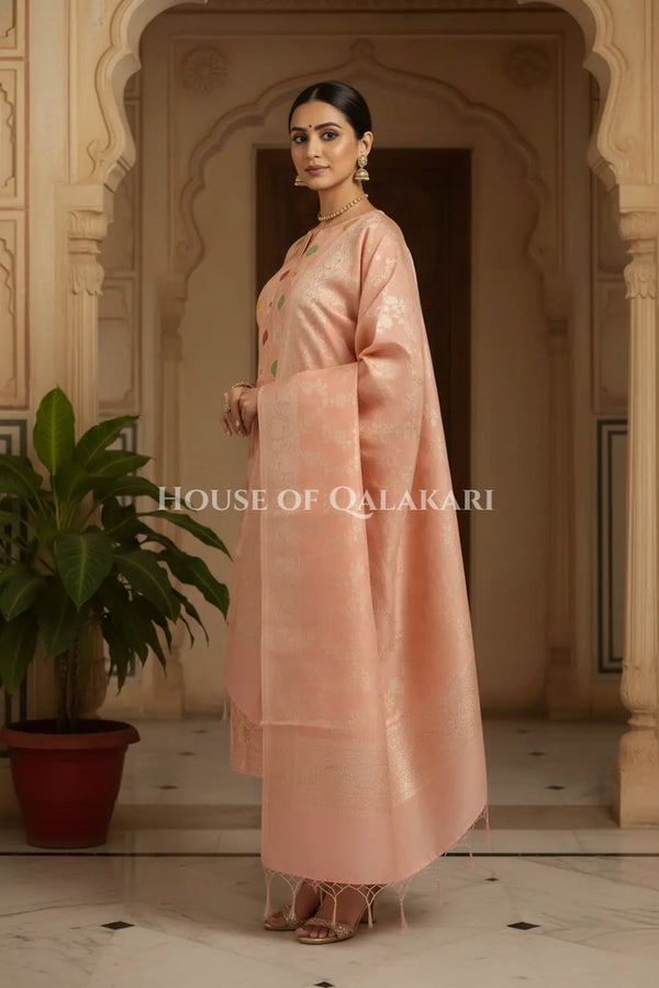 Banarasi Chanderi Cotton Unstitched Dress Material in Peach and with matching zari floral jaal dupatta – side pose