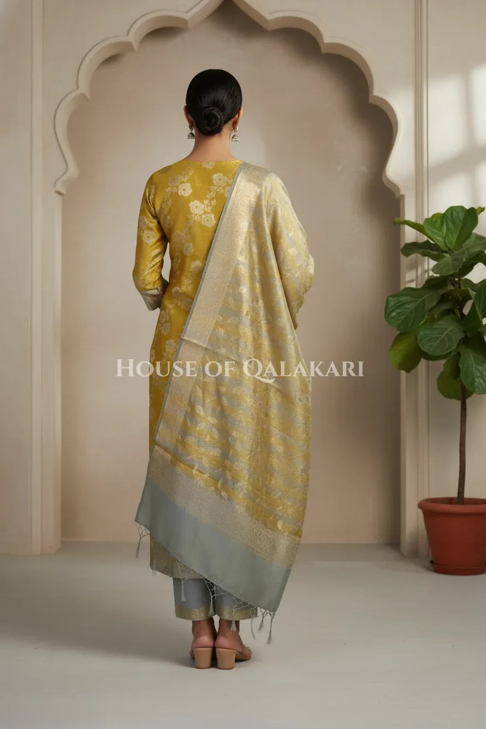Banarasi Cotton Silk blend Unstitched Dress Material in mustard and silver grey contrast with Intricate Zari Buti – back pose