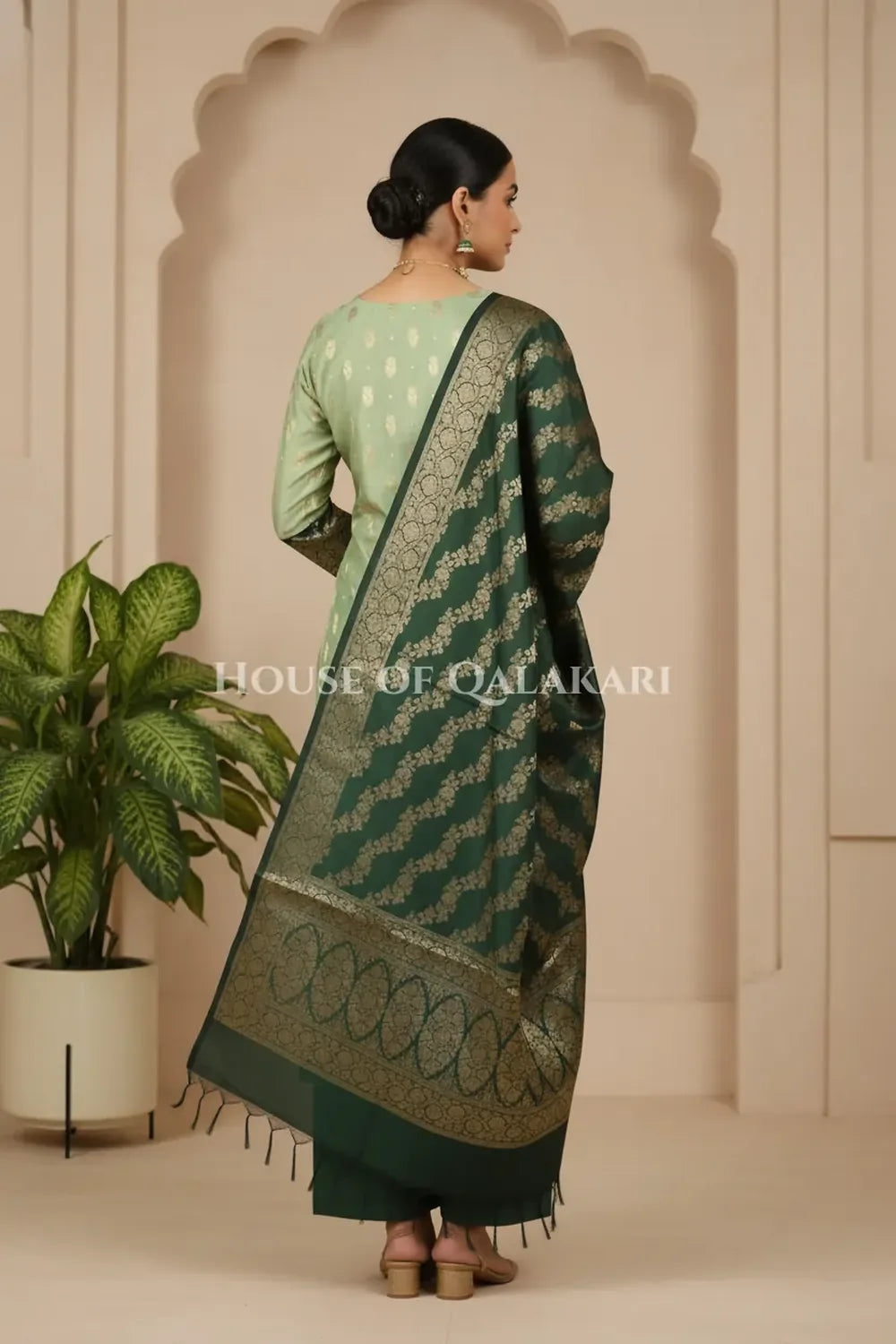 Banarasi Silk in pistachio green and bottle green contrast with Intricate Zari Buti – back pose