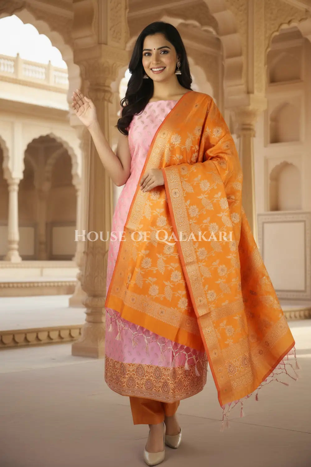 Banarasi Unstitched Dress Material in Dull Pink and with all over leaf buti and resham border along with floral resham jaal dupatta – festive pose