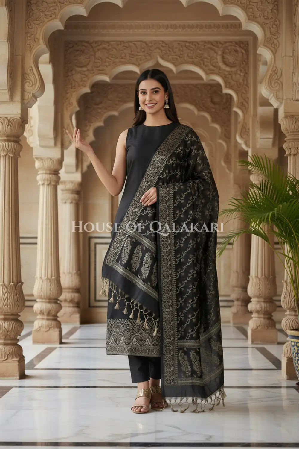 Banarasi Unstitched Dress Material in Black and with plain body and resham border and diagonally striped resham dupatta – festive pose