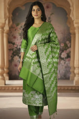 Banarasi silk Unstitched Dress Material in Light Olive Green and with lotus floral border and diagonal striped zari work dupatta – front pose