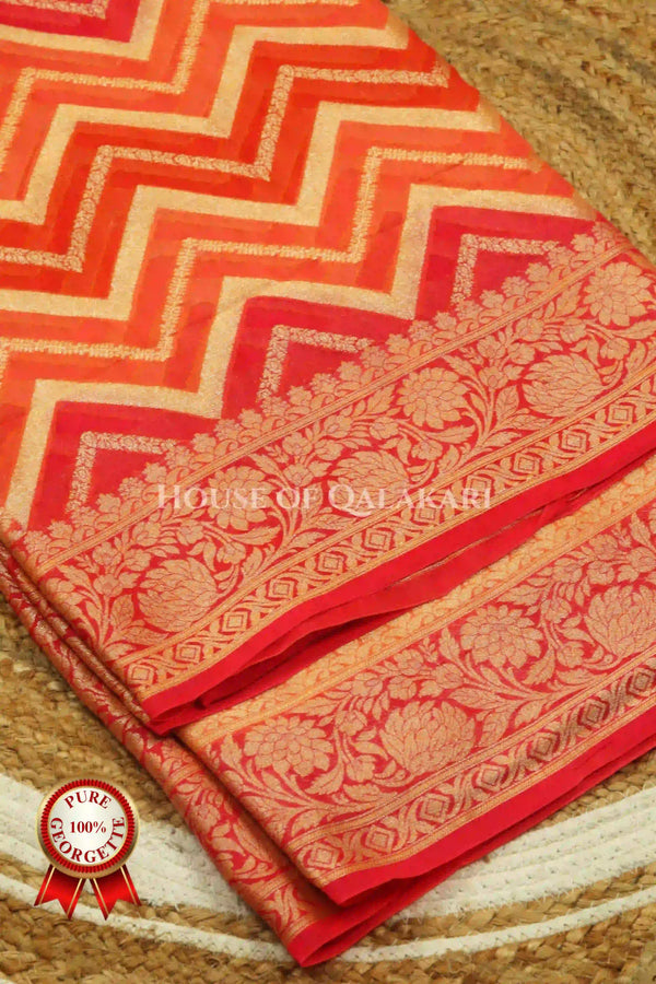 Khaddi Banarasi Saree in Orange tones with zig-zag chevron wave
