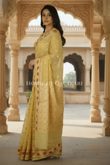Khaddi Banarasi Saree in light yellow with all over buti