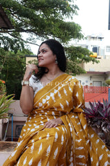 Mustard Bagru Mulmul cotton Saree with Off-White Prints