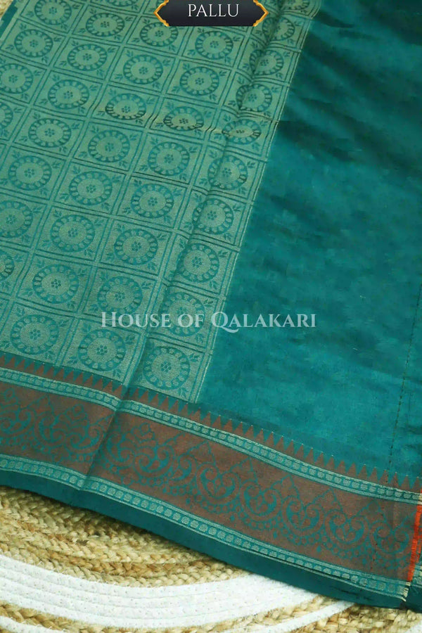 Blue-Green Banarasi Mulmul cotton patola Saree with Geometric Floral Cross Buti & contrast rust-maroon Border